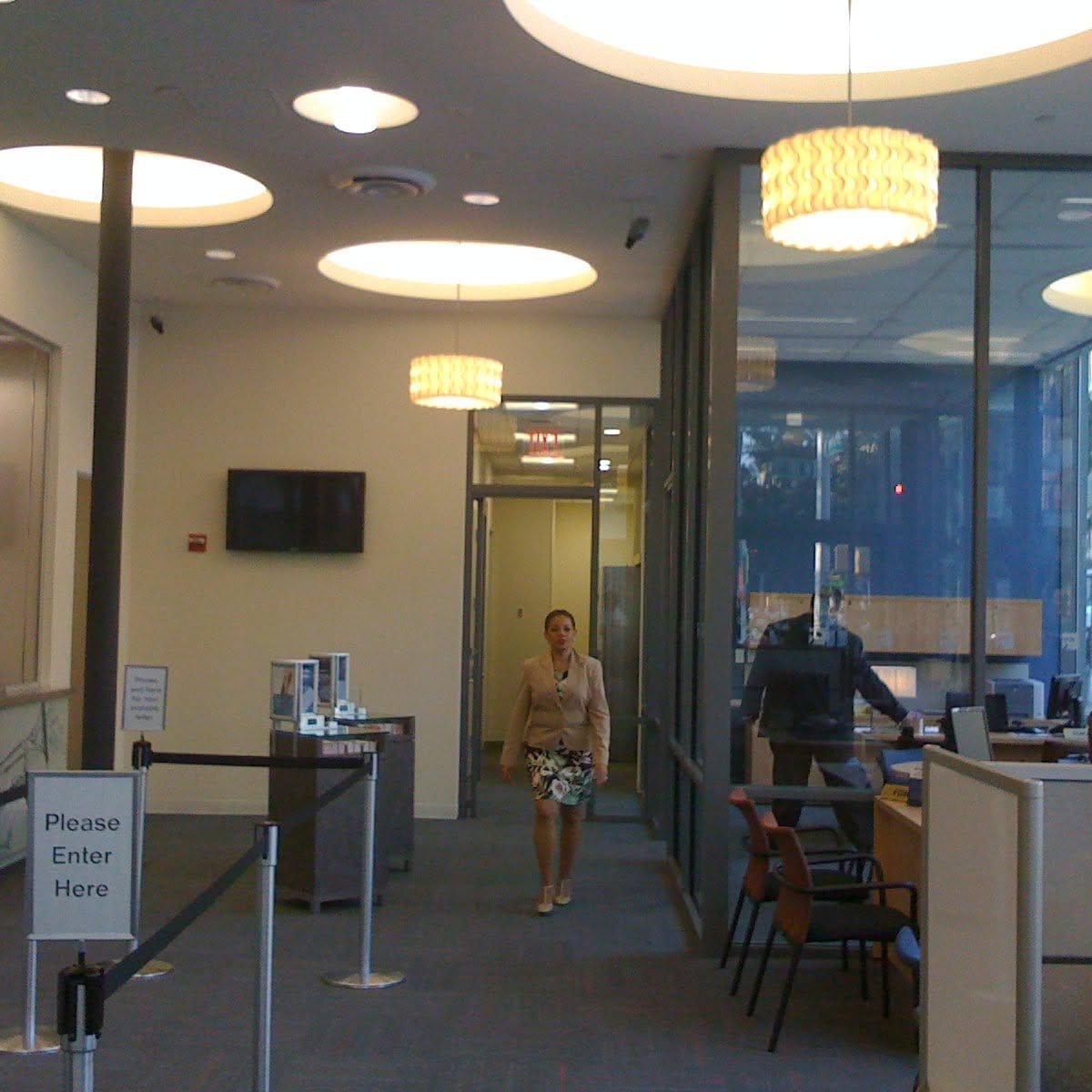 Reception lobby with warm pendant lighting installation
